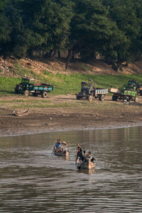 People sitting on riverbank