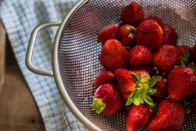 High angle view of strawberries in container on table