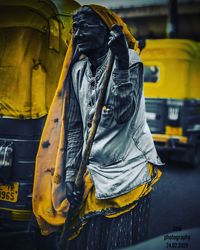 Rear view of man standing on street