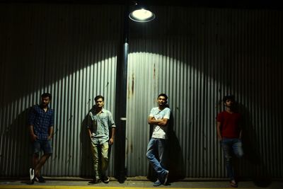 Full length of young couple standing in corridor