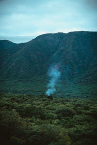 Scenic view of volcanic mountain against sky