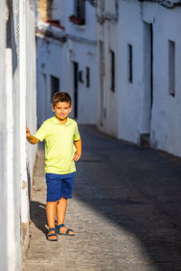 Portrait of boy standing on street