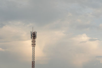 Low angle view of communications tower against sky