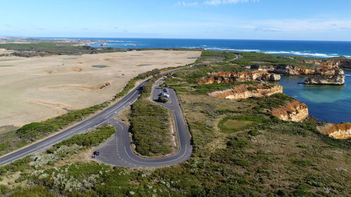 High angle view of road by sea against sky