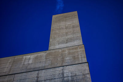 Low angle view of building against clear blue sky