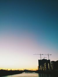 Built structure against clear sky at sunset