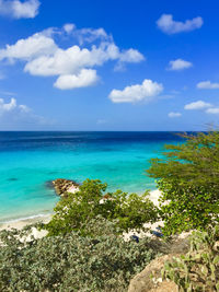 Scenic view of sea against cloudy sky