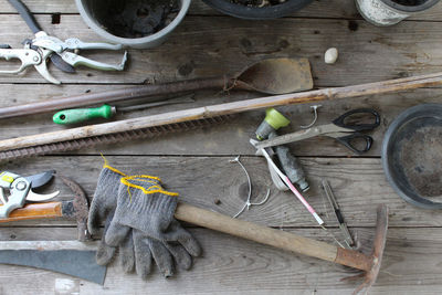 High angle view of tools on table against wall