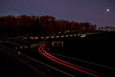 High angle view of light trails on road at night