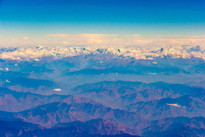 Scenic view of dramatic landscape against sky during winter