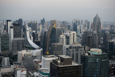 High angle view of modern buildings against sky in city