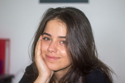 Close-up of young woman at home