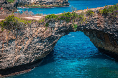 High angle view of rocks on sea