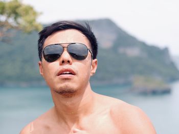 Portrait of young man wearing sunglasses