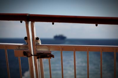 Close-up of railing against sea