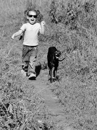 Full length of man and dog on street