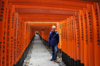 Full length of man standing in shrine
