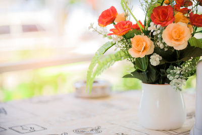 Close-up of flower vase on table