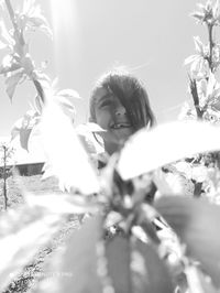 Portrait of girl against plants