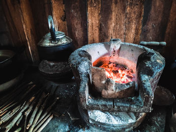 Close-up of burning candles on wood