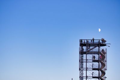 Low angle view of tower against clear blue sky