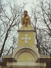 Low angle view of statue against sky