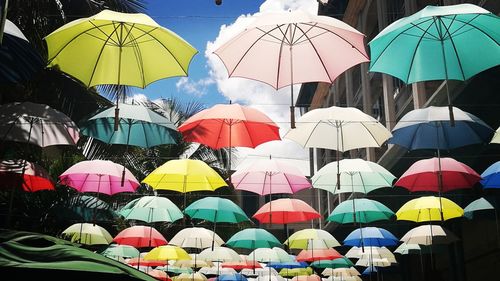 Multi colored umbrellas hanging at market stall