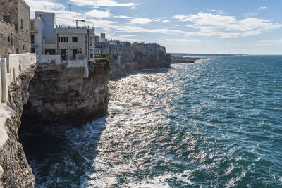 Rough and breathtaking sea. polignano a mare sunlit. puglia. italy