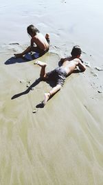 High angle view of men on beach