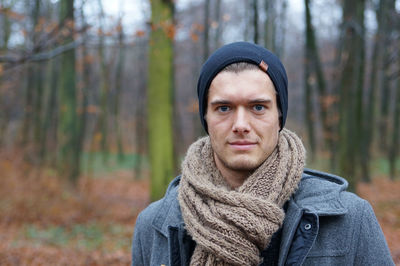 Portrait of man in forest during winter