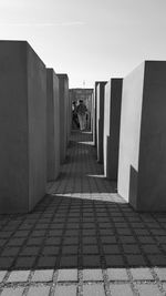 Corridor of building against clear sky