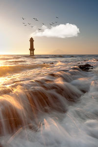 Scenic view of sea against sky during sunset