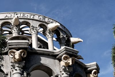 Low angle view of statue against building