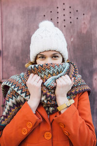 Portrait of young woman with winter hat and scarf