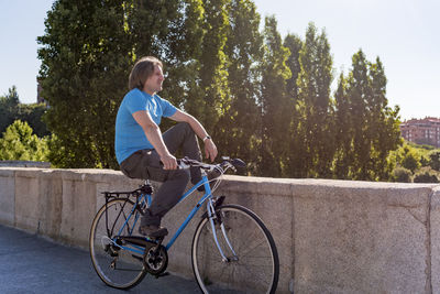 Caucasian man riding bicycle in the city