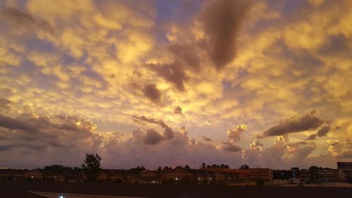 Panoramic view of townscape against sky during sunset