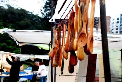 Close-up of clothes hanging on boat against sky