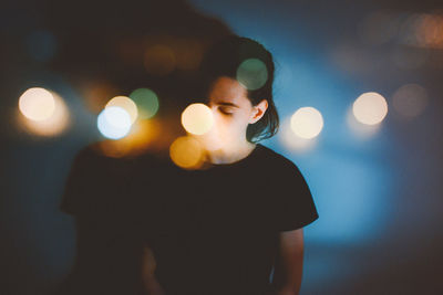 Woman and blurred lights