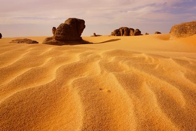 Rock formations in desert against sky