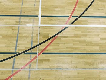 High angle view of hardwood floor against wall