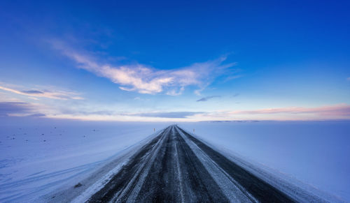 Surface level of ice road against sky during sunset iceland 