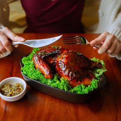 Midsection of man preparing food