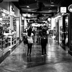 Rear view of man walking on floor