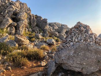 Rock formation on land against sky