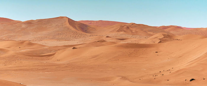 Scenic view of desert against clear sky