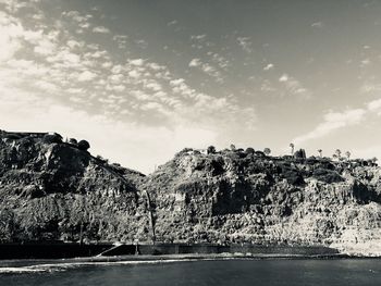 Scenic view of sea and landscape against sky