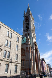 Low angle view of building against blue sky