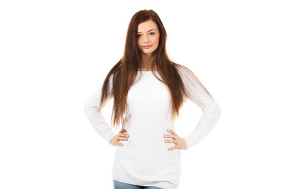 Portrait of woman standing against white background