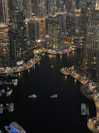 High angle view of illuminated buildings in city at night