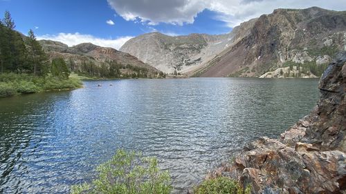 Scenic view of lake and mountains against sky